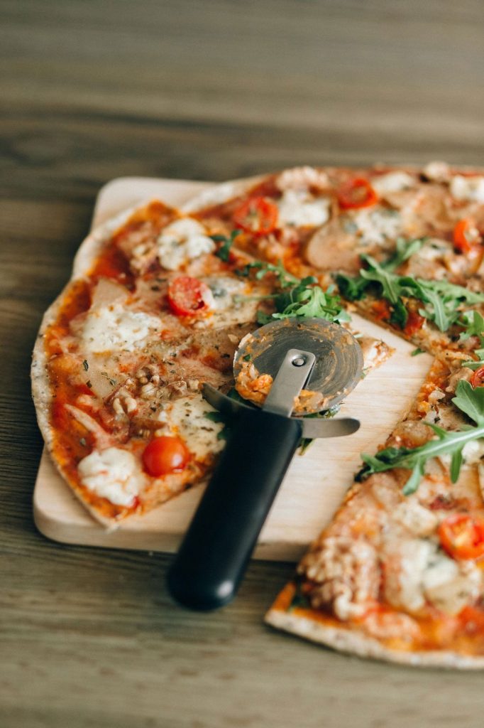 Sliced pizza with cutter tool