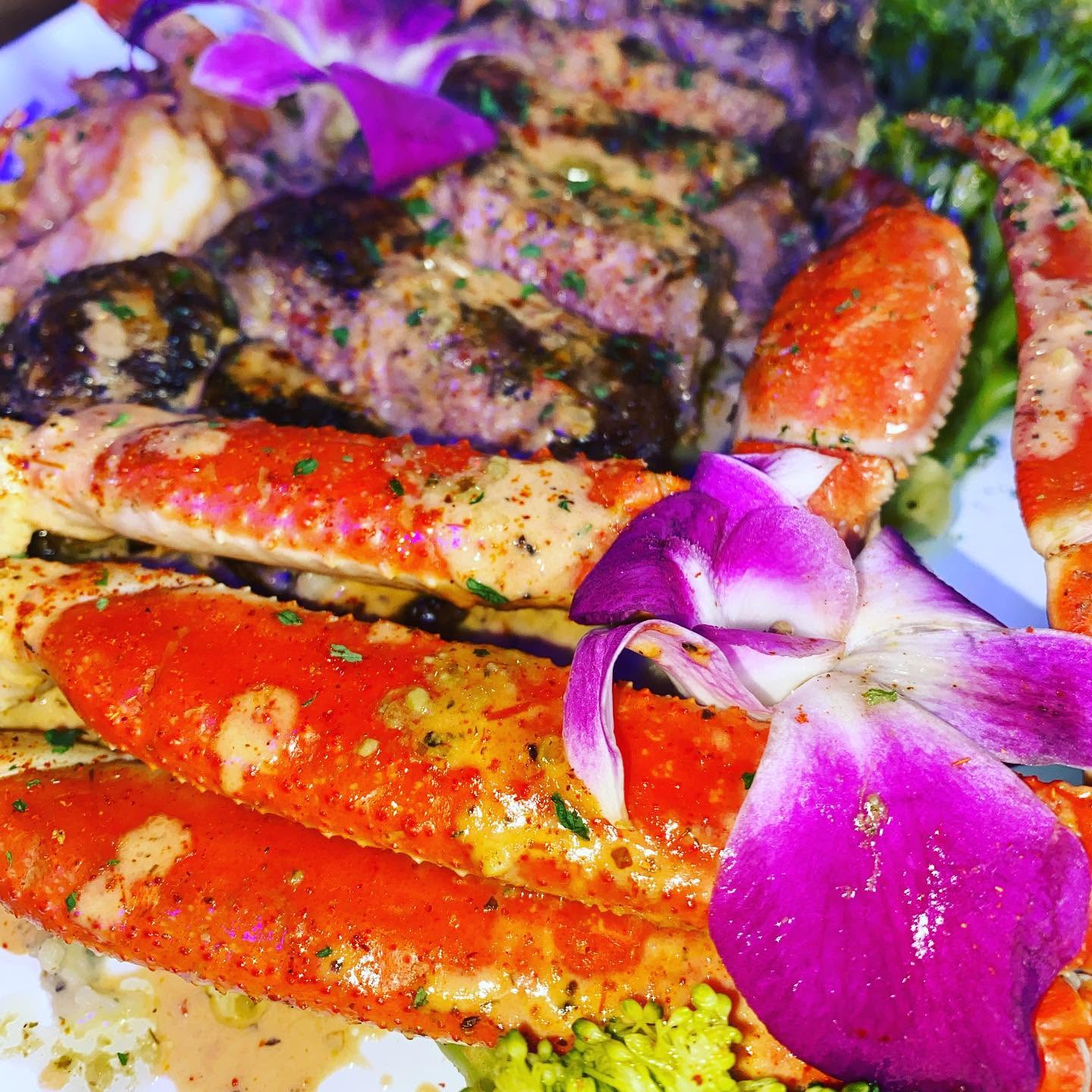 Crabbae catering platter featuring fresh crab legs and seasoned shrimp