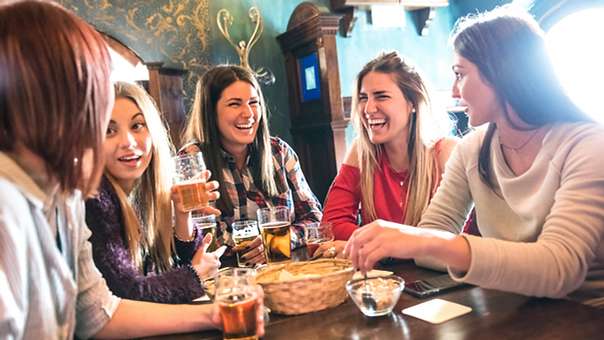Group of women drinking beer